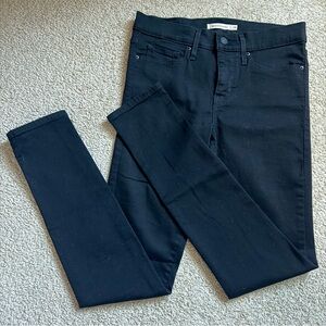 Levi's mid rise black shaping skinny jeans size 4 311 28W 30L